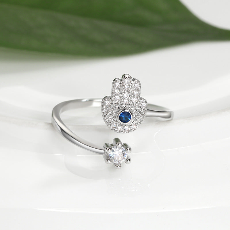 Evil Eye Protection Ring by SmartMuslim; silver-tone open-ended Islamic ring with Hamsa hand and blue center eye