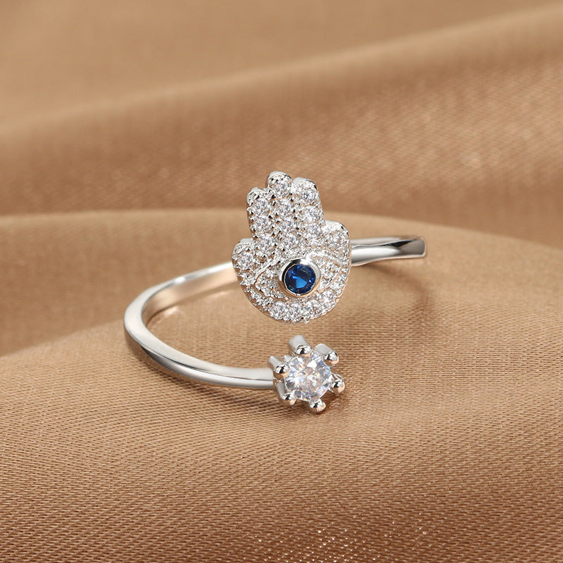 Evil Eye Protection Ring set of 2: blue-eye pave hamsa motif ring and a separate clear solitaire band, silver-tone
