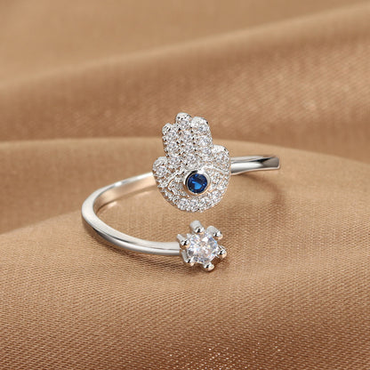 Evil Eye Protection Ring set of 2: blue-eye pave hamsa motif ring and a separate clear solitaire band, silver-tone