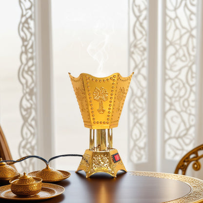 Premium plug-in bakhoor burner, gold-tone ornate electric incense burner with floral motifs and rising smoke.