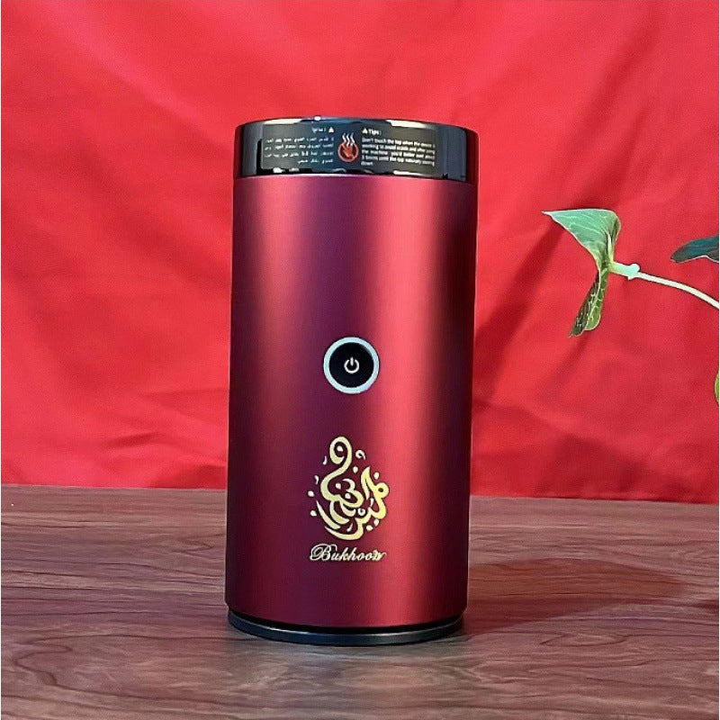 Bluetooth Bakhoor Burner, electric bakhoor incense burner by SmartMuslim, burgundy cylindrical unit with power button.