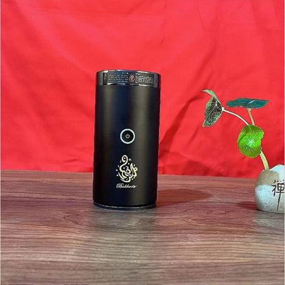 The Bluetooth Bakhoor Burner, black electric bakhoor incense burner with a circular power button.