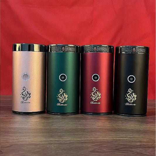The Bluetooth Bakhoor Burner electric incense burner by SmartMuslim, set of four in rose gold, green, red and black.