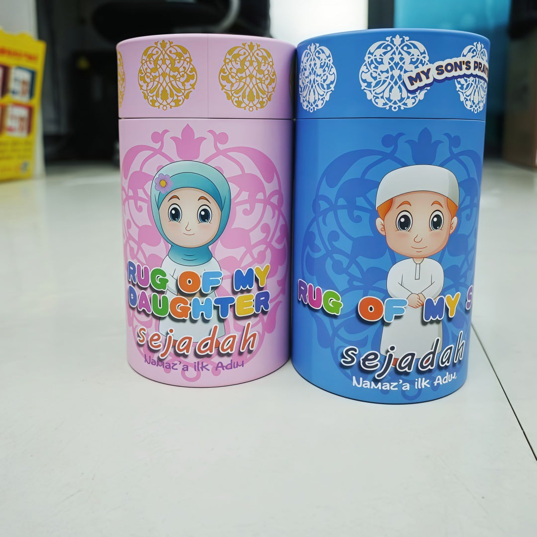 Two SmartMuslim Little Muslim Starter Set tins in pink and blue with illustrated girl in hijab and boy sejadah designs.