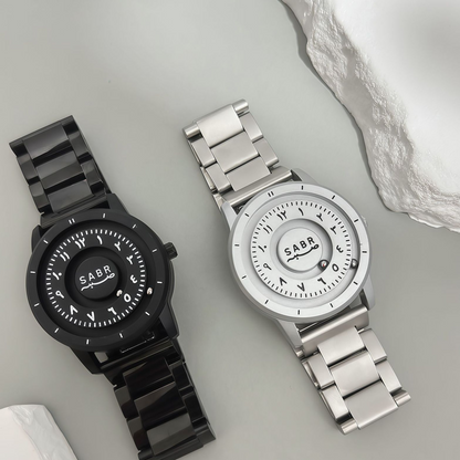 Sabr Watch by SmartMuslim; two metal Islamic watches in black and silver.
