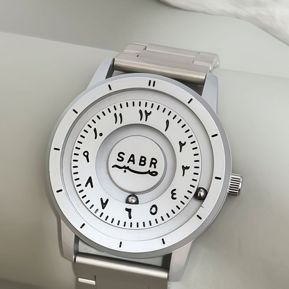 Sabr Watch by SmartMuslim, stainless steel Islamic watch with white dial and Arabic numerals.