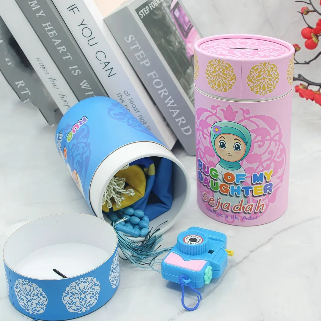 Little Muslim Starter Set by SmartMuslim; two tins (pink and blue) with hijab girl design and prayer beads.